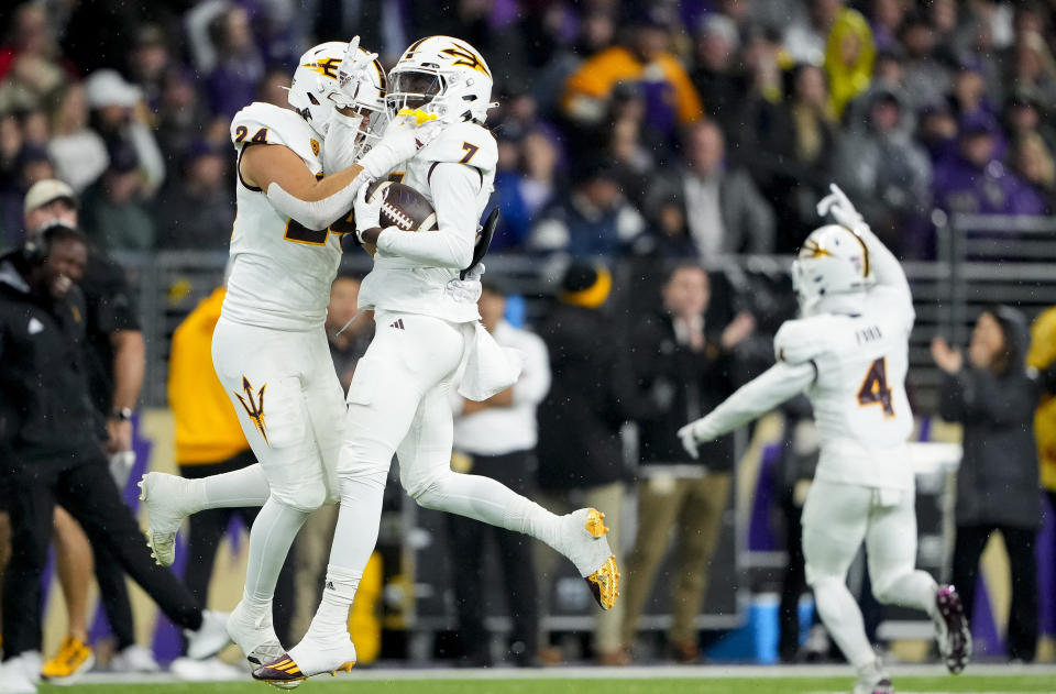 Arizona State defensive back Shamari Simmons (7) celebrates recovering a fumble by Washington quarterback Michael Penix Jr. with teammate Tate Romney, left, during the first half of an NCAA college football game Saturday, Oct. 21, 2023, in Seattle. (AP Photo/Lindsey Wasson)