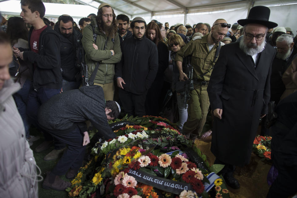 Mourners attend the funeral of Israeli staff sergeant Elisha Yehonatan Lober, who was killed in battle in the Gaza Strip, at the Mount Herzl military cemetery in Jerusalem, Israel, Wednesday, Dec. 27, 2023. (AP Photo/Leo Correa)
