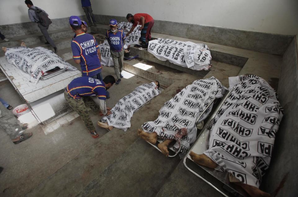 Bodies of alleged militants killed in an operation by security forces are tended to by workers from the Chhipa Welfare Association, at a mortuary, in Karachi, Pakistan, Wednesday, Feb. 22, 2017. Rao Anwar, a police official in Karachi, said eight Taliban-linked militants were killed in the raid. Pakistan said it will send paramilitary forces to crack down on Islamic militants in the Punjab province, a move that the ruling party of Prime Minister Nawaz Sharif had long rejected because of opposition among his Islamist supporters. (AP Photo/Fareed Khan)