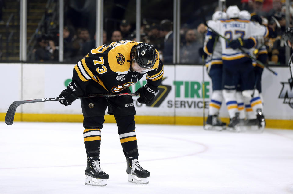 Boston Bruins' Charlie McAvoy reacts as the St. Louis Blues' celebrate Brayden Schenn's goal, right, during the third period in Game 7 of the NHL hockey Stanley Cup Final, Wednesday, June 12, 2019, in Boston. (AP Photo/Michael Dwyer)