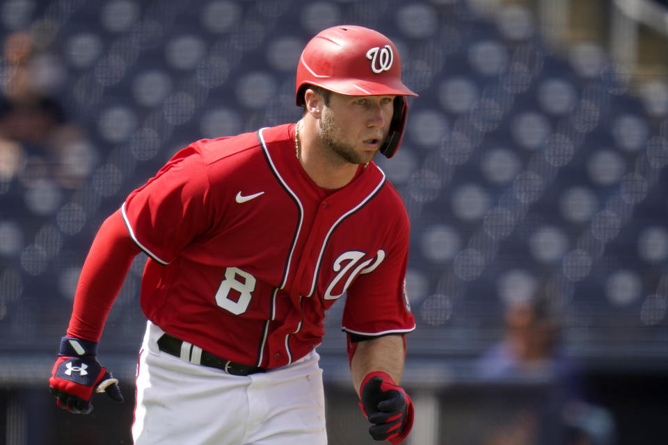 Washington Nationals' Carter Kieboom heads to first for a single during the second inning of a spring training baseball game against the Houston Astros Monday, March 1, 2021, in West Palm Beach, Fla. (AP Photo/Jeff Roberson)