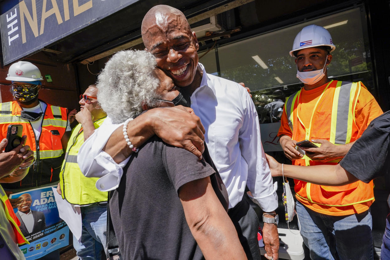 Democratic mayoral candidate Eric Adams hugs a supporter after a campaign event, Thursday, June 17, 2021, in the Harlem neighborhood of New York. (Mary Altaffer/AP)