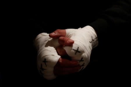 Hands of Miriam Gutierrez "La Reina", 36, are pictured in detail as she waits to fight Samantha Smith for the lightweight European Championship in Torrelodones