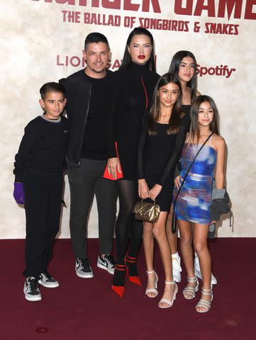 <p>Steve Granitz/FilmMagic</p> Adriana Lima and boyfriend Andre Lemmers pose with their children