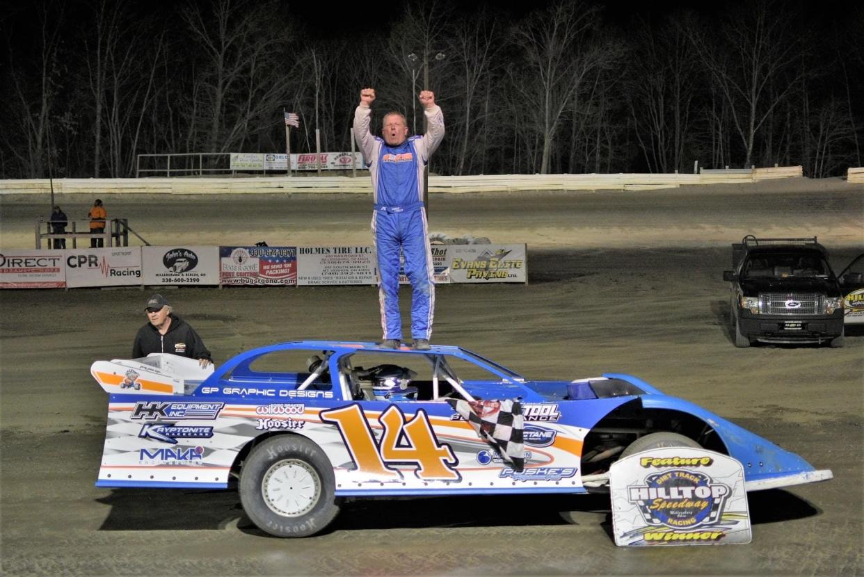 Corey Conley celebrating in victory lane after his feature win in the Holmes Tire late model division.