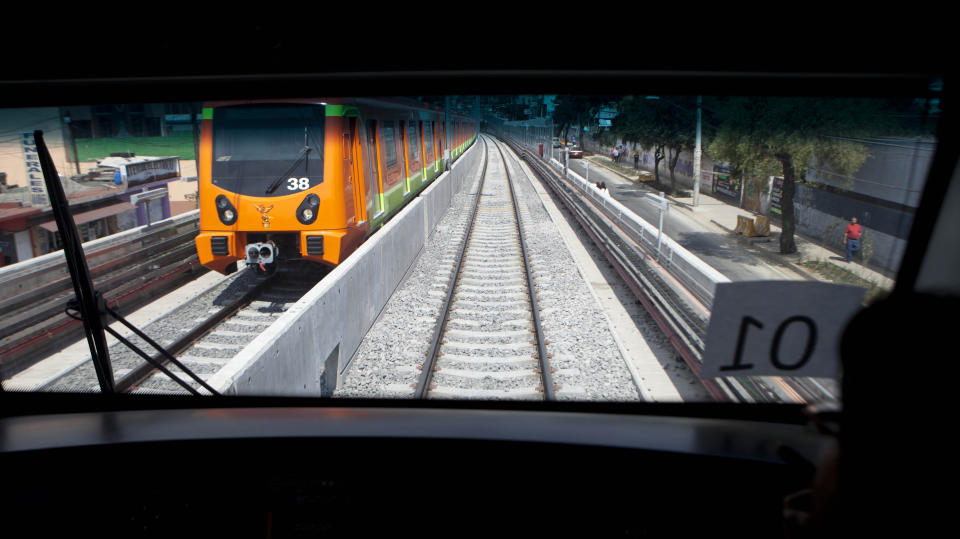 The line 12 subway takes its inaugural journey in Mexico City, Tuesday Oct. 30, 2012. The line 12 or Golden line is 25 km (15.5 miles) long, making it the longest and most modern subway line in the capital.  (AP Photo/Eduardo Verdugo)