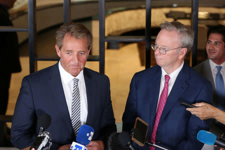 U.S. Senator Jeff Flake (L) and former Google CEO Eric Emerson Schmidt speak to journalists during a news conference in Havana, Cuba, June 4, 2018. REUTERS/Alexandre Meneghini