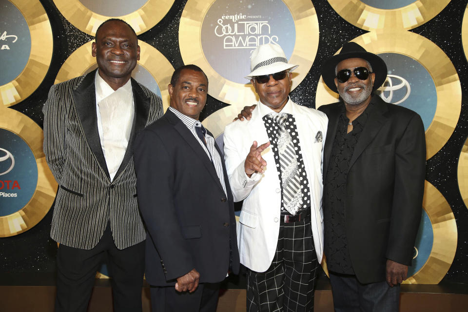 FILE - George Brown, from left, Ronald Bell, Dennis Thomas and Robert "Kool" Bell, of Kool and the Gang, appear at the 2014 Soul Train Awards in Las Vegas on Nov. 7, 2014. Brown died Nov. 16, 2023 in Los Angeles, after a battle with cancer. He was 74. (Photo by Omar Vega/Invision/AP, File)