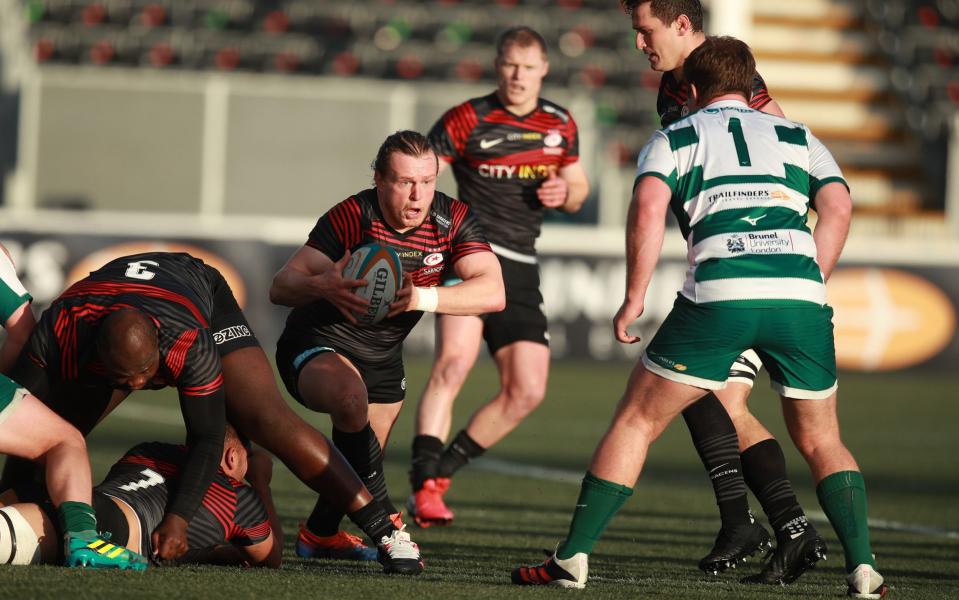 Tom Woolstencroft carries the ball forwards for Saracens - GETTY IMAGES