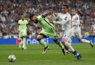 Real Madrid's Cristiano Ronaldo in action with Manchester City's Nicolas Otamendi Reuters / Juan Medina