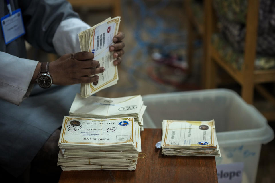 Election officials sort postal ballots ahead of Tuesday's general election at the Deputy Commissioners office in Samdrup Jongkhar, Bhutan, Sunday, Jan. 7, 2024. (AP Photo/Anupam Nath)