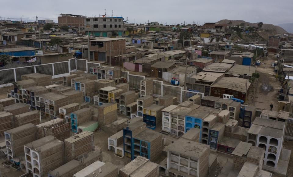 Tombs fill the Cristo el Salvador cemetery at Villa el Salvador on the outskirts of Lima, Peru, amid the COVID-19 pandemic, Tuesday, June 30, 2020. (AP Photo/Rodrigo Abd)