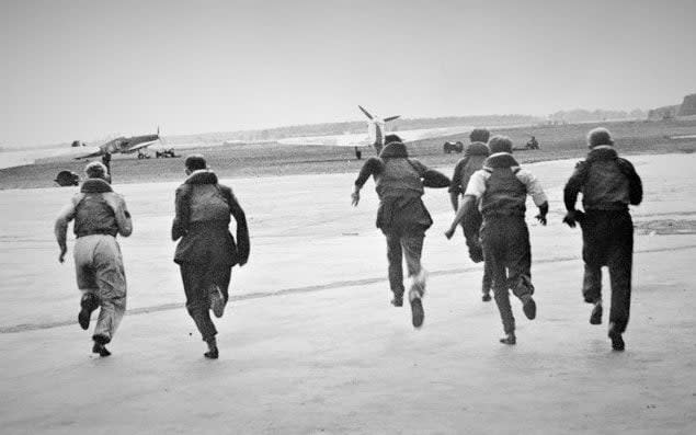 John Hemingway, in shirt sleeves, sprinting towards his aircraft - family photograph