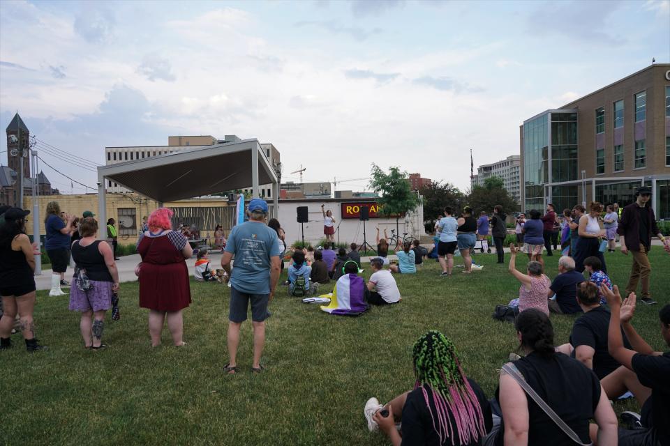 A crowd rallying for transgender rights are led in cheers of "trans rights are human rights," at Van Epps Park in Sioux Falls on Wednesday, June 7, 2023.