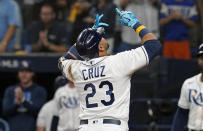Tampa Bay Rays' Nelson Cruz (23) points upward after scoring on his home run against the Boston Red Sox during the third inning of Game 1 of a baseball American League Division Series, Thursday, Oct. 7, 2021, in St. Petersburg, Fla. (AP Photo/Steve Helber)