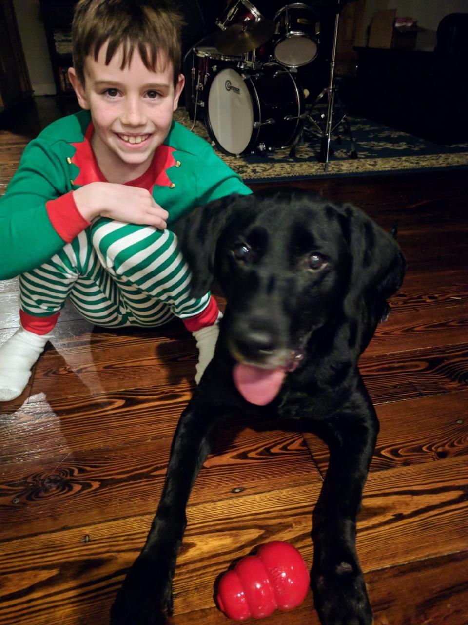 Ian Farley poses with his dog Jackson.