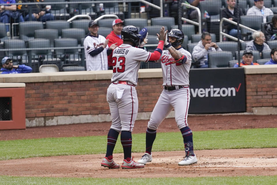 Atlanta Braves' Michael Harris II, left, greets Kevin Pillar after Pillar hit a two-run homer during the second inning of the first baseball game of a doubleheader against the New York Mets at Citi Field, Monday, May 1, 2023, in New York. (AP Photo/Seth Wenig)