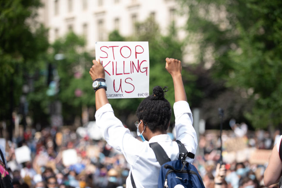 People take part in a demonstration in Washington, United Staets, on June 6, 2020 over the death of George Floyd, a black man who was in police custody in Minneapolis. Floyd died after being restrained by Minneapolis police officers. (Photo by Zach D Roberts/NurPhoto via Getty Images)