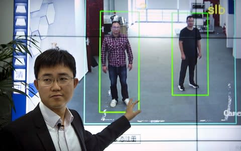 Gait recognition is part of a major push to develop artificial-intelligence and data-driven surveillance across China - Credit: AP Photo/Mark Schiefelbein