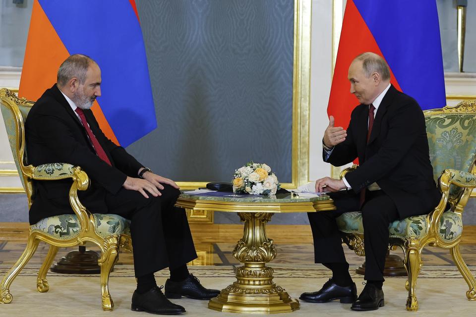 Russian President Vladimir Putin, right, gestures as he speaks to Armenian Prime Minister Nikol Pashinyan on the sidelines of a meeting of the Eurasian Economic Union at the Kremlin in Moscow, Russia, on Wednesday, May 8, 2024. Russian President Vladimir Putin hailed the economic alliance's performance, saying that it helped boost the members' economic potential. (Evgenia Novozhenina/Pool Photo via AP)