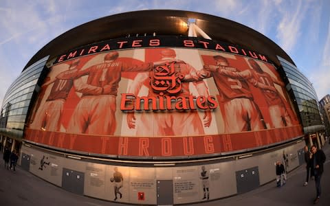 In this file photo taken on September 29, 2015 A picture shows the outside of The Emirates Stadium in north London on September 29, 2015 ahead of kick off of the UEFA Champions League Group F football match between Arsenal and Olympiakos. Arsenal announced the club's biggest-ever sponsorship deal on February 19, 2018, extending their shirt partnership with Dubai-based airline Emirates by five years - Credit: AFP