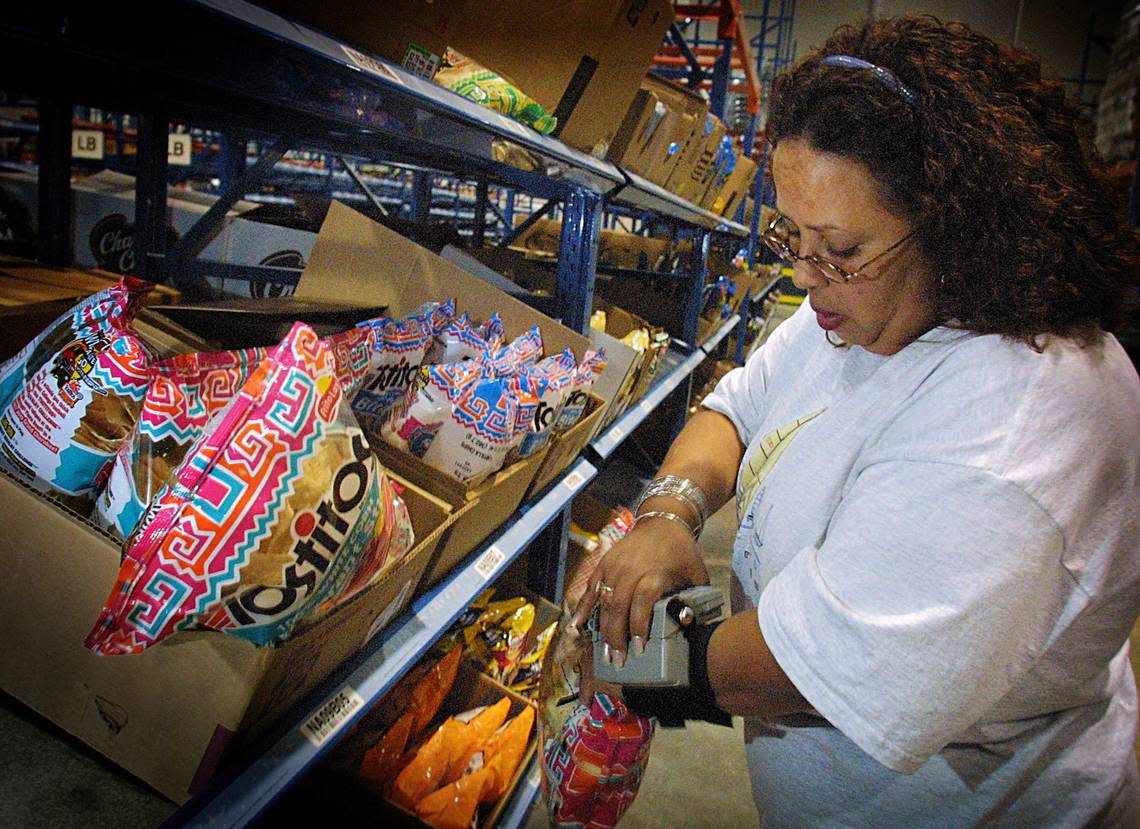 Aracelis Rodriguez, a PublixDirect shopper, wears a computer on her wrist that tells her what items to get.