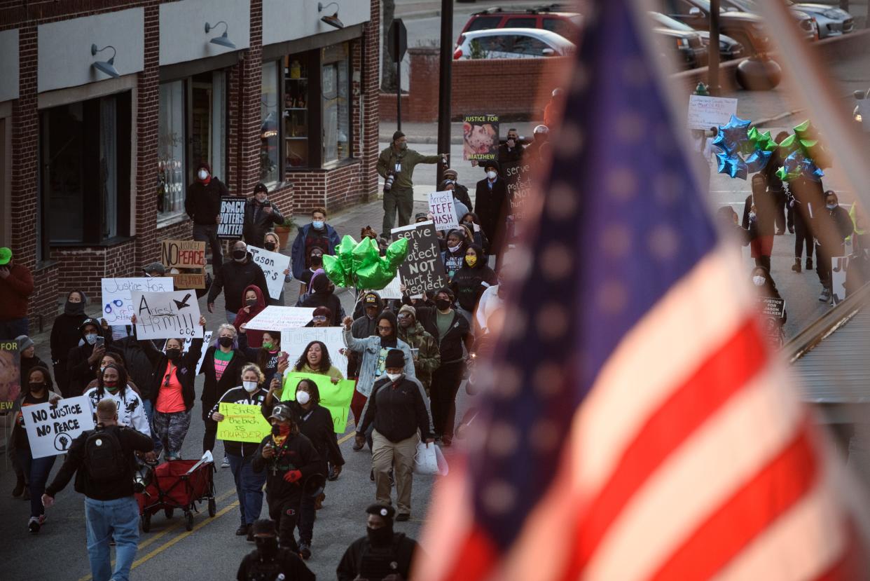 Demonstrators march through downtown Fayetteville during a Justice for Jason Walker demonstration on Friday, Jan. 14, 2022. Jason Walker, 37, was shot and killed on Saturday by an off-duty Cumberland County Sheriff’s deputy.