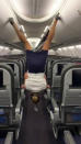 This flight attendant shows off her remarkable acrobatic skills to close the overhead bins with her feet - while wearing high heels. Lindsey O'Brien, 35, gripped onto the armrests before flipping upside down and using her feet to close four luggage containers above. She twirled back down to the aisle and lifted her arms in triumph as her fellow crew members cheered her on. The video was filmed in June aboard an aircraft which had been grounded in her home city of Philadelphia, Pennsylvania, due to Covid-19.