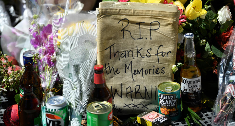 Tributes to Australian cricketer Shane Warne outside the MCG in Melbourne, Monday, March 7, 2022. Australian cricket legend Shane Warne has died of a suspected heart attack, aged 52. Warne was found unresponsive in his villa in Koh Samui, Thailand. (AAP Image/Joel Carrett) NO ARCHIVING