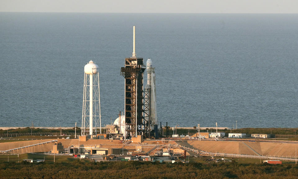A Falcon Heavy SpaceX rocket sits on pad 39A at the Kennedy Space Center in Cape Canaveral, Fla., after the launch was scrubbed Wednesday, April 10, 2019. SpaceX will try again to launch the rocket tomorrow. (AP Photo/John Raoux)