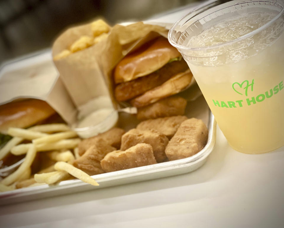 A double burg’r, crispy tots, crispy chick’n nuggets, french fries, Hart House signature dippin sauces, as well as a limeade drink are pictured on Thursday, Aug. 25, 2022, in Los Angeles. Kevin Hart opened his first plant-based, fast-food restaurant called Hart House on Thursday in the Westchester neighborhood of Los Angeles near the city’s airport. He wants this new venture to attract regular plant-base eaters along with those who haven’t yet been introduced to that world of healthy eating. (AP Photo/Jonathan Landrum Jr.)