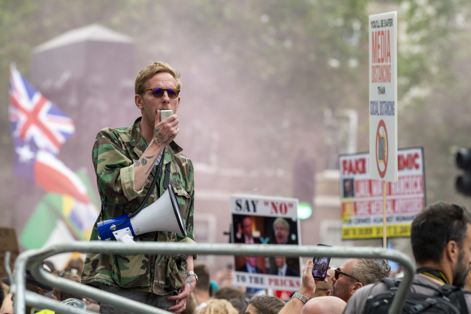 LONDON, UNITED KINGDOM - 2021/06/26: Laurence Fox seen on security barriers addressing the crowd outside Downing Street during the anti-lockdown march Unite for Freedom while shouting on a mega-phone against Boris Johnson & the Government. (Photo by Dave Rushen/SOPA Images/LightRocket via Getty Images)