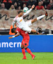 <p>Leipzig’s Fernandes da Silva, up, and Leverkusen’s Leon Bailey challenge for the ball during the German Bundesliga soccer match between Bayer Leverkusen and RB Leipzig in Leverkusen, Germany, Saturday, Nov. 18, 2017. (AP Photo/Martin Meissner) </p>