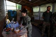 Ukrainian service members celebrate an Orthodox Easter near a front line in Donetsk region