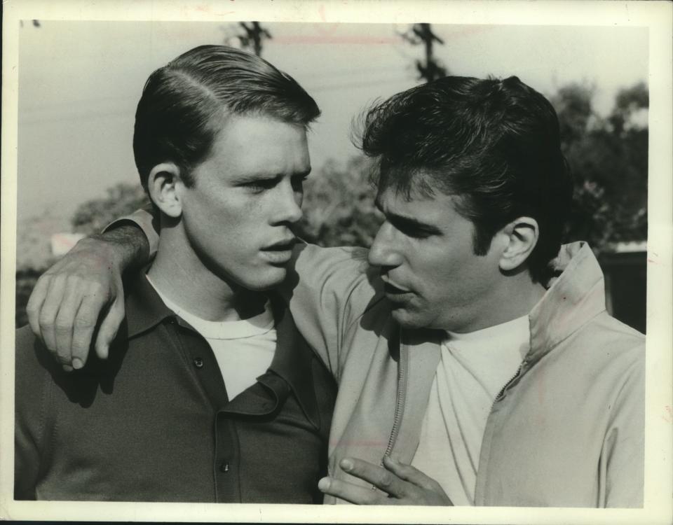 Ron Howard, left, as Richie Cunningham, gets some advice from Fonzie (Henry Winkler) in the pilot episode of "Happy Days," the long-running sitcom set in Milwaukee. The show, which debuted in January 1974, spawned the spinoffs "Laverne & Shirley" and "Mork & Mindy."