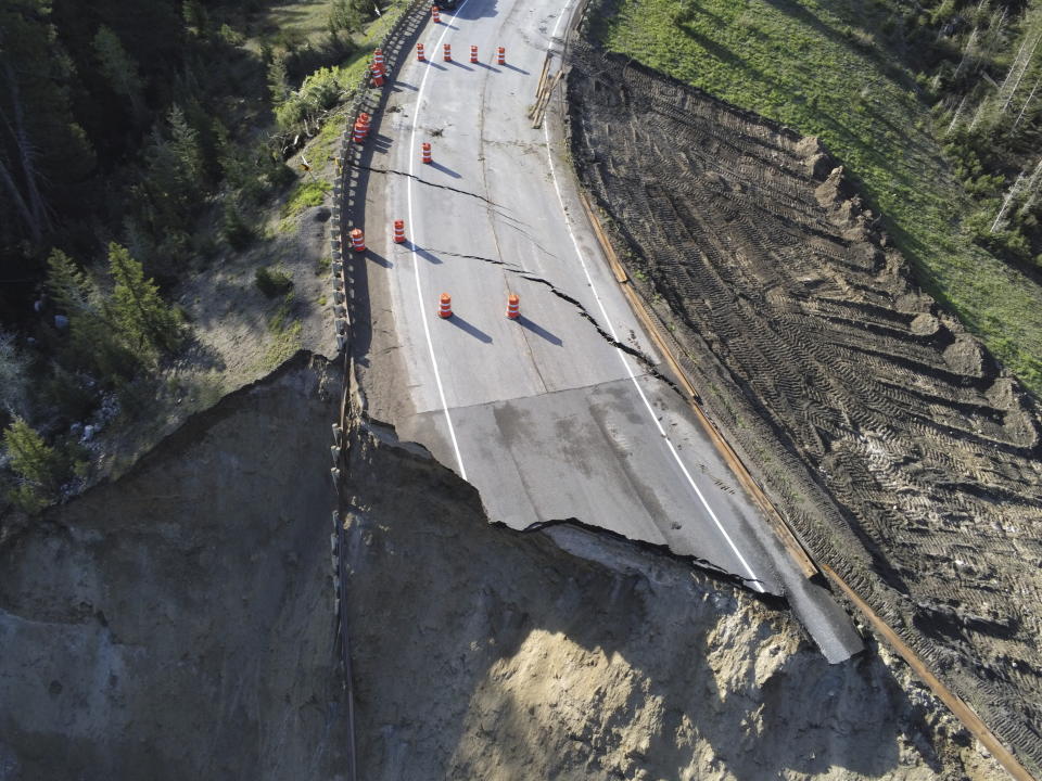 This photo provided by Wyoming Highway Patrol shows a damaged section of Teton Pass near Jackson, Wyo., on Saturday, June 8, 2024, that officials said had “catastrophically failed.” (Wyoming Highway Patrol via AP)