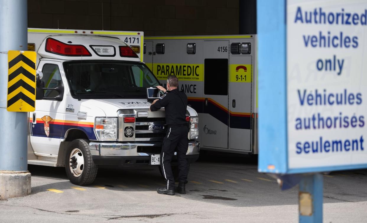 Ottawa paramedics spent more than 500 hours per day on average last year waiting to transfer patients to hospital ERs. (Justin Tang/The Canadian Press - image credit)