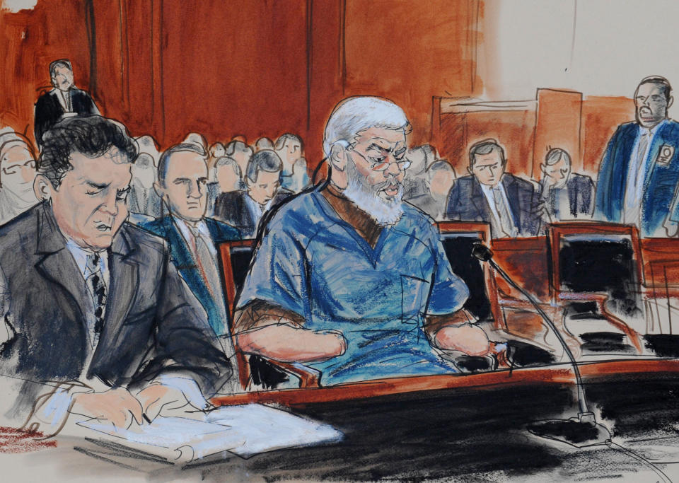 FILE- In this Oct. 9, 2013 file courtroom drawing, defense attorney, Jeremy Schneider, left, represents accused terrorist Mustafa Kamel Mustafa, center, in Manhattan federal court, in New York. Jury selection begins Monday, April 14, 2014, in the New York trial of the Egyptian Islamic preacher extradited from Great Britain on charges he conspired to support al-Qaida. (AP Photo/ Elizabeth Williams, File)