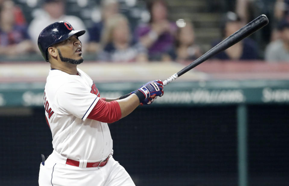 Cleveland Indians' Edwin Encarnacion watches his ball after hitting a three-run home run off Minnesota Twins' Matt Belisle in the seventh inning of a baseball game, Monday, Aug. 6, 2018, in Cleveland. Rajai Davis and Erik Gonzalez scored on the play. (AP Photo/Tony Dejak)