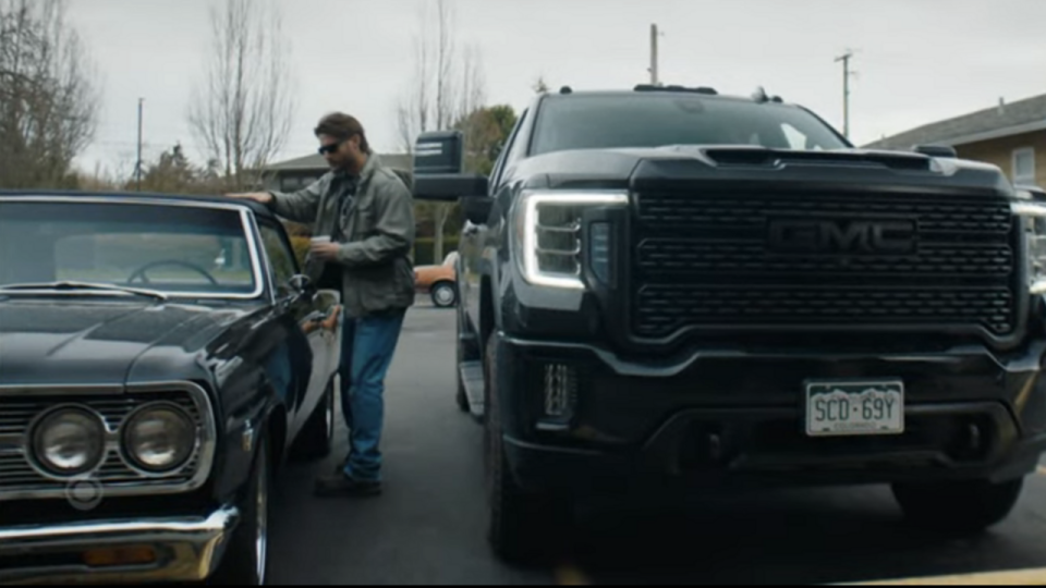 Jensen Ackles touching the top of a black car in Tracker Season 1x12