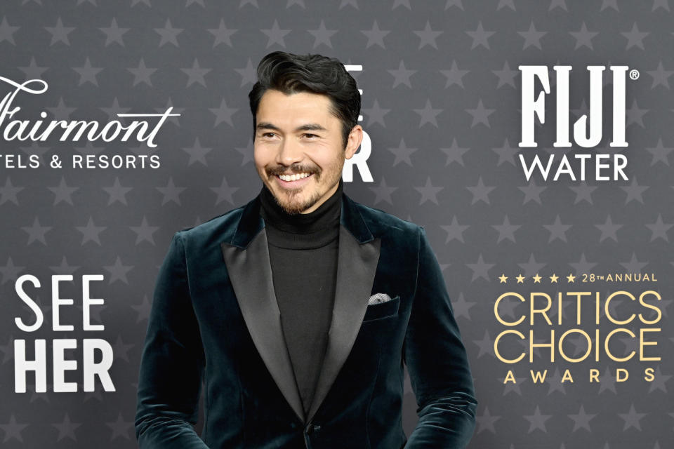 British-Malaysian Henry Golding posing for the camera at the Critics Choice Awards.