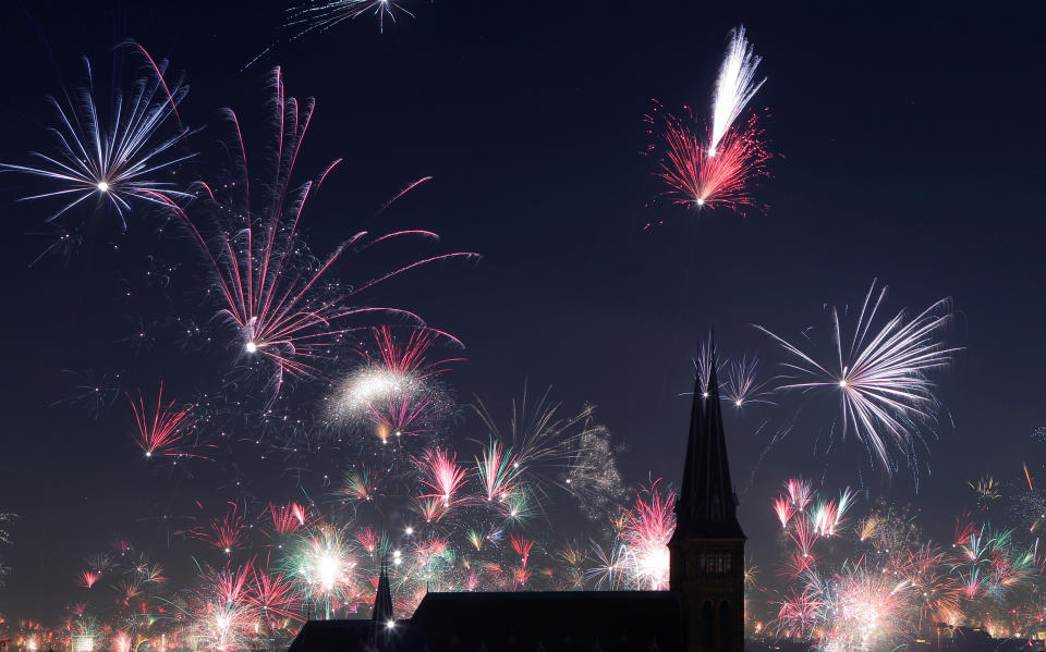 Fireworks explode around Familienkirche church during New Year's celebrations in Vienna, Austria on January 1, 2018. (Photo: Heinz-Peter Bader / Reuters)