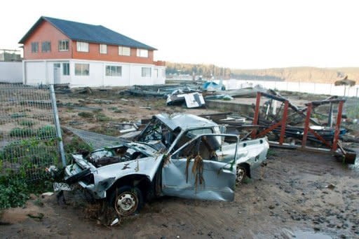 A destroyed car pictured in Dichato, 500 km south of Santiago, on March 12, 2011, hours after the place was hit by tsunami waves from Japan's huge quake causing some damage. Chile, Ecuador and Peru ordered evacuations of coastal areas Friday and Ecuador also halted oil shipments amid fears of rough seas