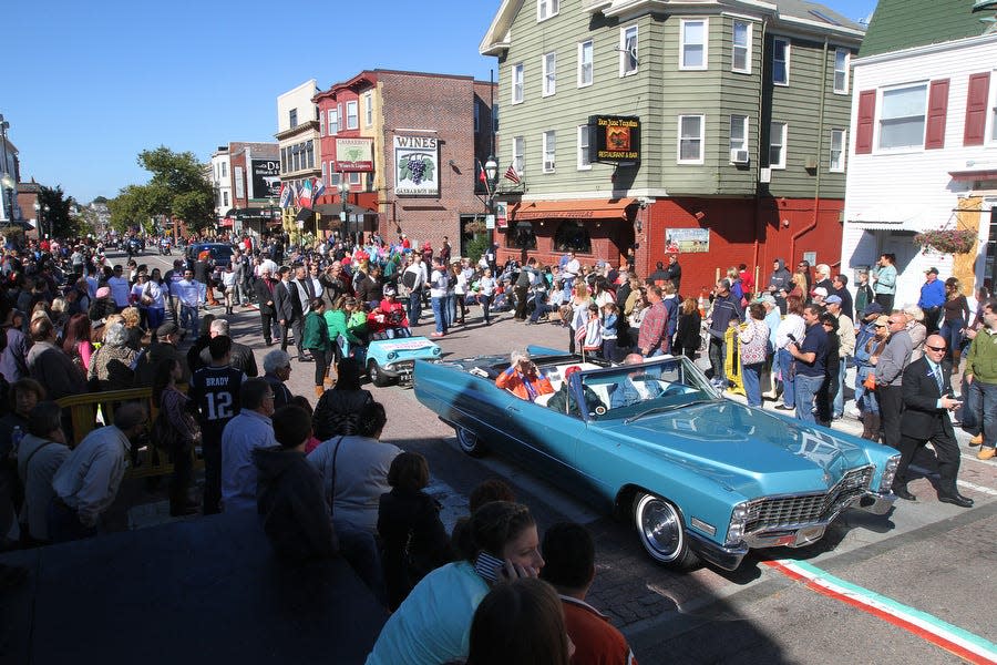 People line Atwells Avenue in Providence to view the 2014 Columbus Day Parade on Federal Hill.