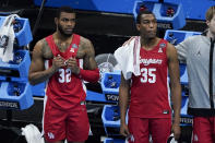 Houston forward Reggie Chaney (32) and forward Fabian White Jr. (35) watch the end of a men's Final Four NCAA college basketball tournament semifinal game against Baylor, Saturday, April 3, 2021, at Lucas Oil Stadium in Indianapolis. Baylor won 78-59. (AP Photo/Darron Cummings)