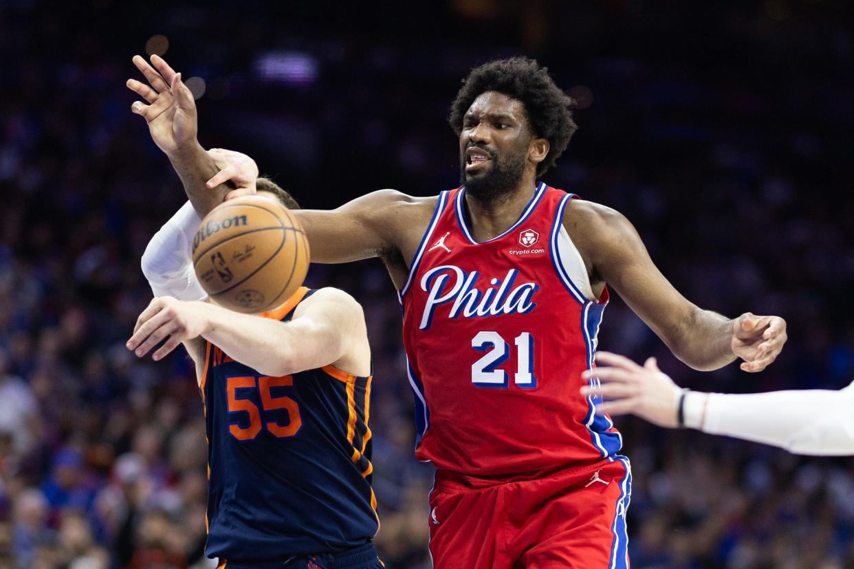 Philadelphia 76ers center Joel Embiid (21) looses control of the ball in front of New York Knicks center Isaiah Hartenstein (55) during the first half of game four of the first round in the 2024 NBA playoffs at Wells Fargo Center.