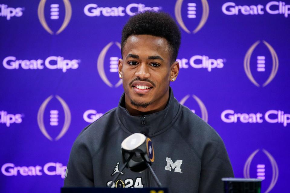 Michigan wide receiver Cornelius Johnson (6) speaks during Media Day at George R. Brown Convention Center in Houston, Texas on Saturday, Jan. 6, 2024.
