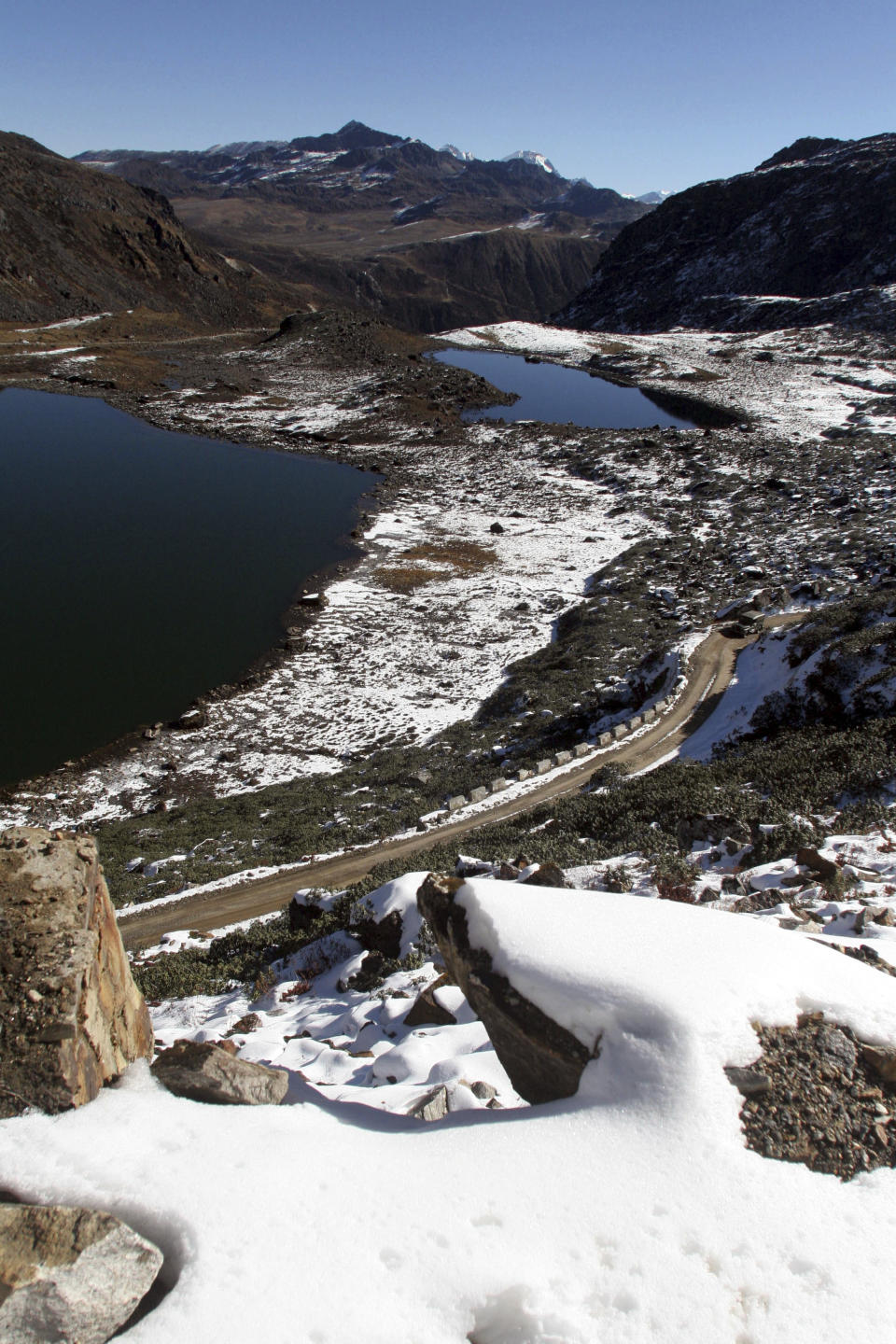 FILE- A view of the road on the way to the Line of Actual Control, at the India-China Border in Tawang, in the northeastern Indian state of Arunachal Pradesh, Monday, Oct. 30, 2006. Indian Army says its soldiers clashed with Chinese troops last week along a disputed border in India's eastern Arunachal Pradesh state. A statement from the Indian Army Monday said the face-off on Friday in areas along the Tawang sector of Arunachal Pradesh resulted in minor injuries to soldiers from both sides. (AP Photo/Mustafa Quraishi, File)