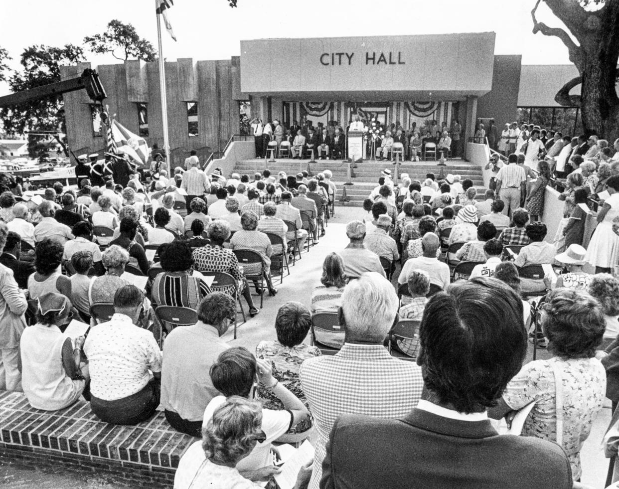 Daytona Beach's city government has run out of its City Hall on the corner of Orange and Ridgewood avenues for 47 years. Now top city staff are looking into the possibility of building a new City Hall in a different location. Pictured is the dedication ceremony for the current City Hall in July 1976, which cost $1.5 million to build.