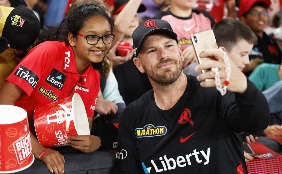 Aaron Finch, pictured here with a Melbourne Renegades fan.